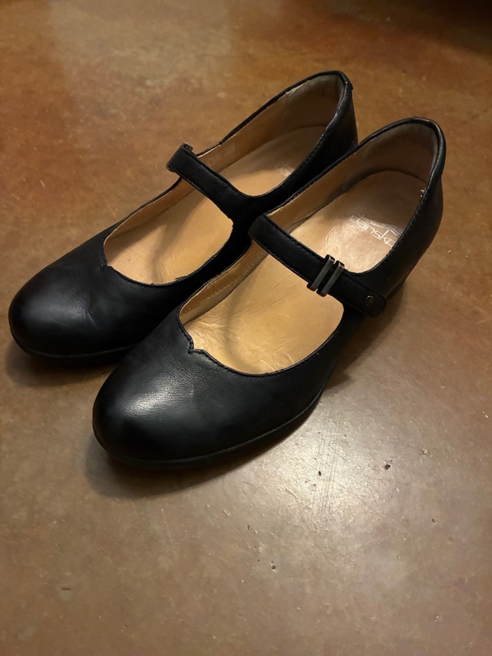 Black leather Mary Janes